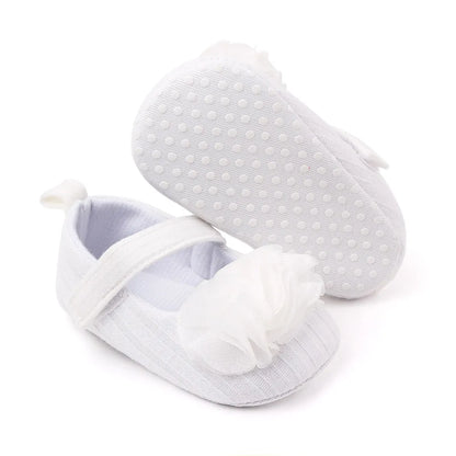 Stylish floral cotton soft sole baby shoes for girls, providing gentle support for little feet.