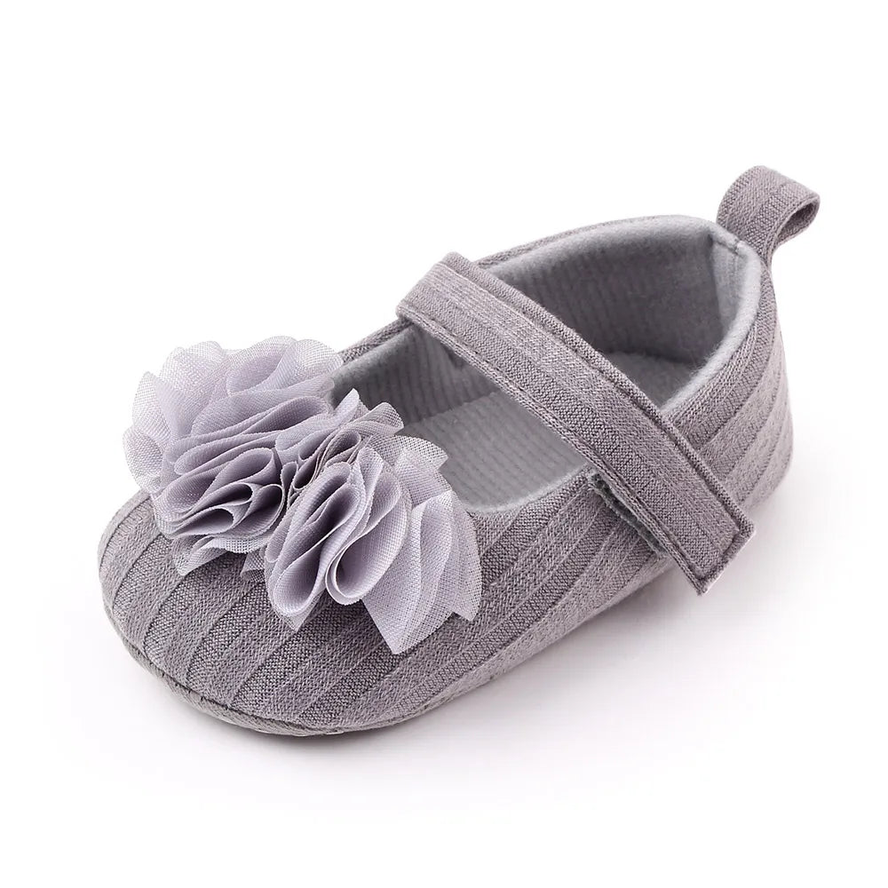 Non-slip floral cotton soft sole baby shoes, ensuring safety for active little girls.