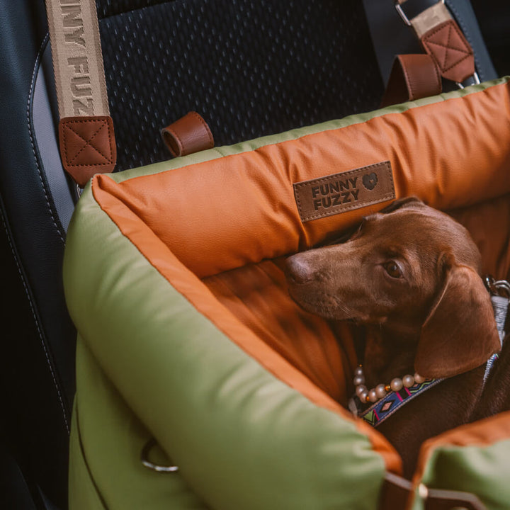 Elevated dog booster seat for cars; comfortable pet travel bed, durable faux leather.
