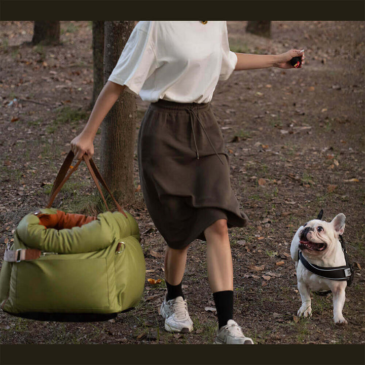 Comfortable pet booster bed; dog car seat with secure attachment for travel safety.