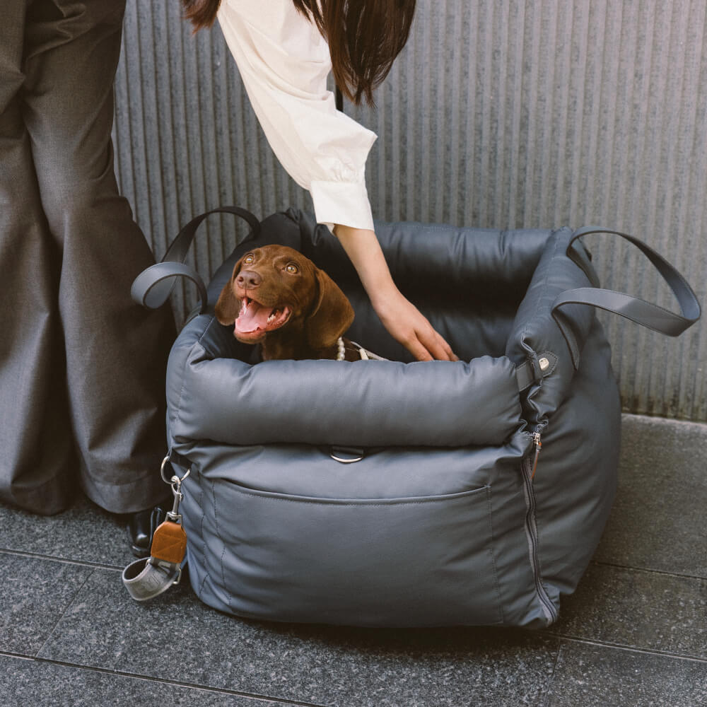 Faux leather dog car seat; comfortable booster bed for secure and happy pet travel.