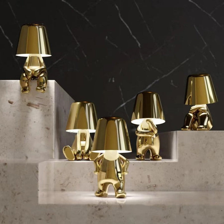 Dimmable table lamp with playful artistic resin design. Creative accent lighting for any room.