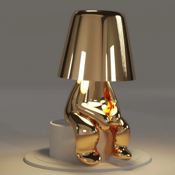 Dimmable table lamp, playful design. Artistic resin construction, portable & touch-controlled creative light.