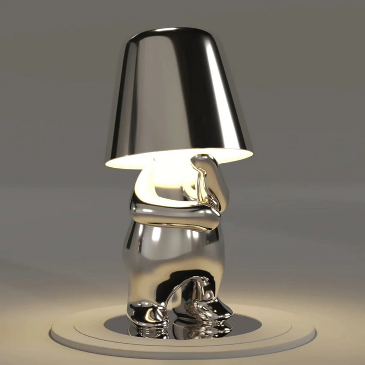Stylish dimmable table lamp. Playful artistic resin design, offering creative and portable accent lighting.