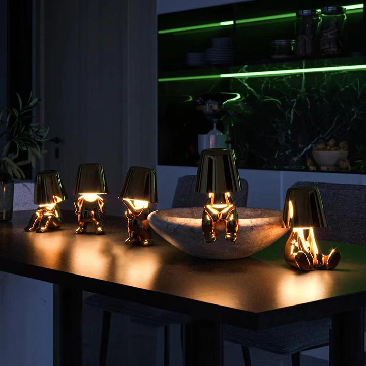 Dimmable table lamp, playful artistic resin design. Touch control, wireless & portable accent light.