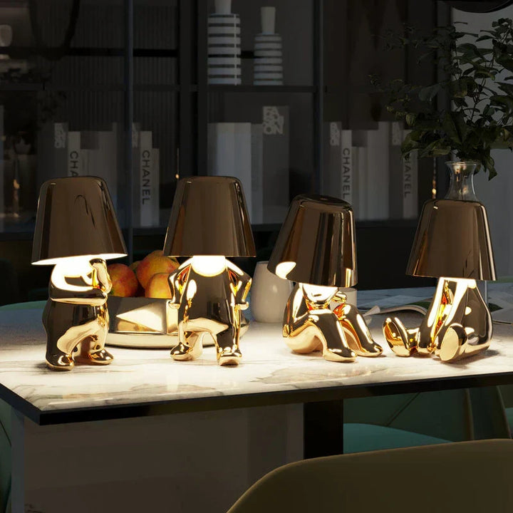 Modern dimmable table lamp with playful artistic design. Resin accent light, wireless & portable.