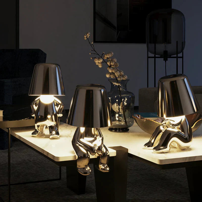 Playful artistic dimmable table lamp. Creative resin mood lighting, portable for any setting.