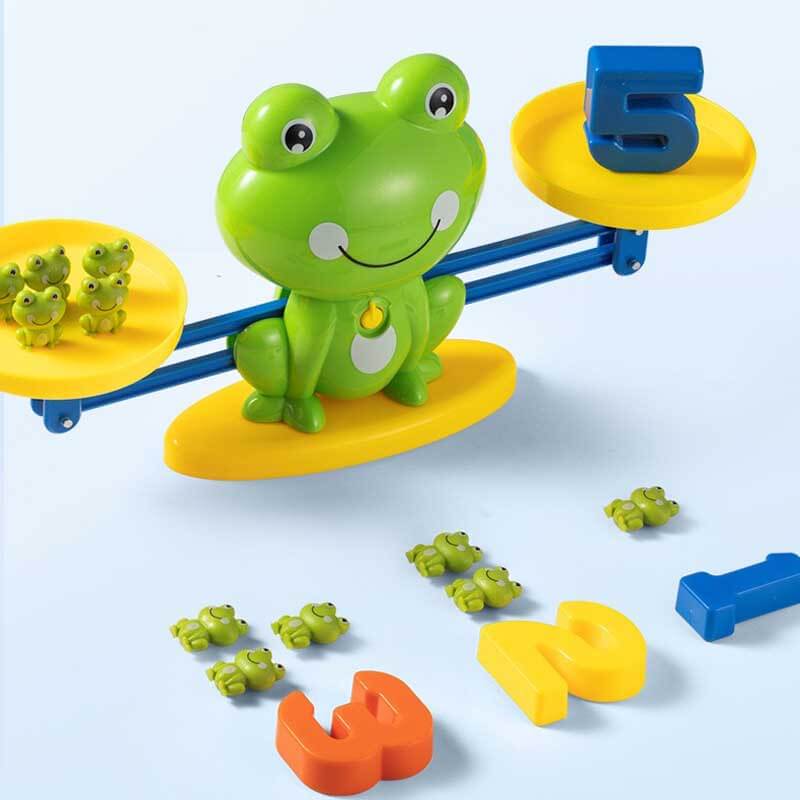 Interactive animal balance scale with small dinosaur figures for educational play