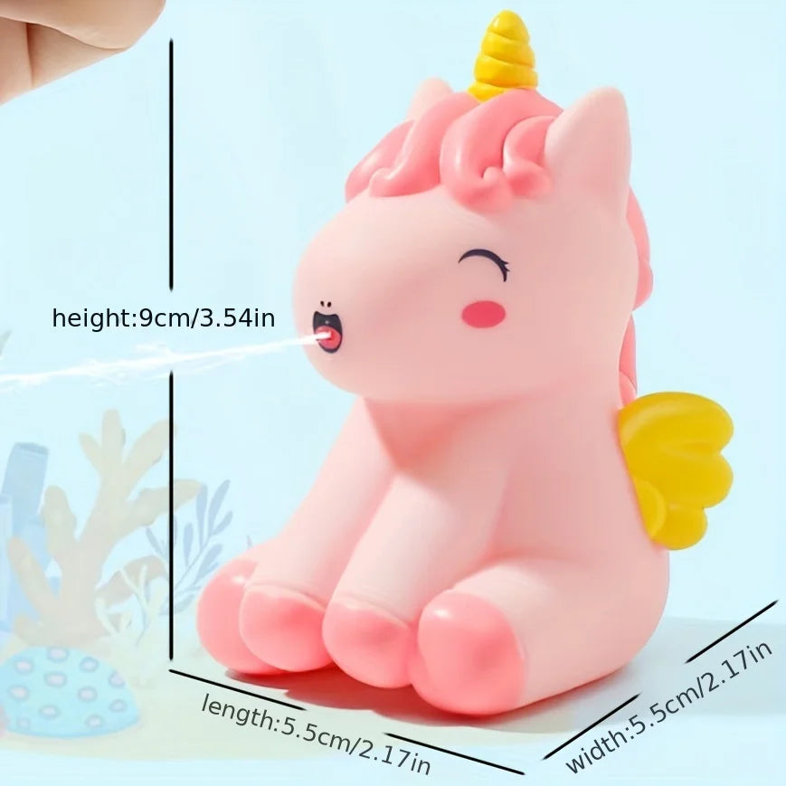 Child happily playing with a unicorn water spray bath toy, making bath time fun