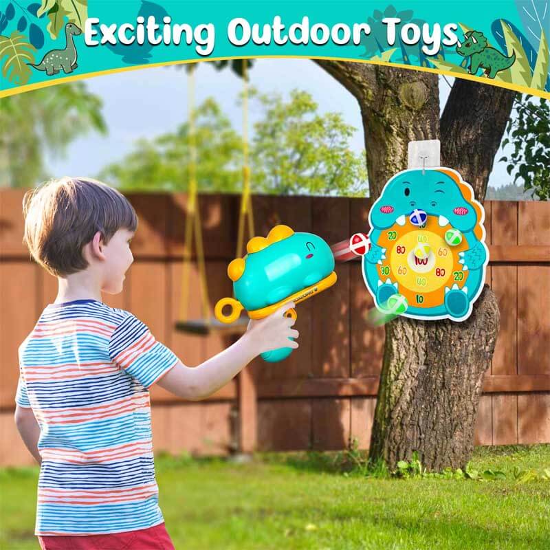 Close-up of the dinosaur-shaped toy launcher aiming a sticky ball at a target