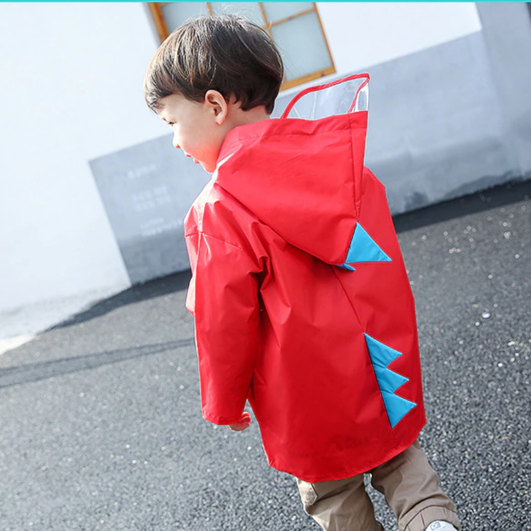 Pink dinosaur waterproof jacket for toddlers, featuring cartoon eyes on the hood, baby clothing rain