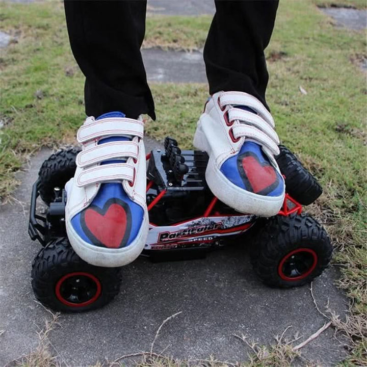 Remote control monster truck jumping obstacles, showcasing extreme all-terrain off-road action.