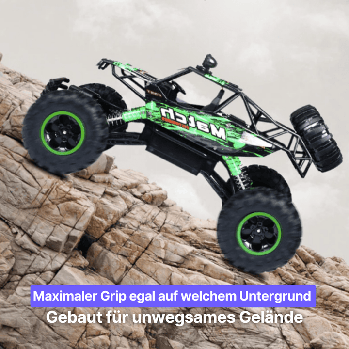 Close-up of rugged wheels & suspension on a powerful all-terrain RC monster truck.