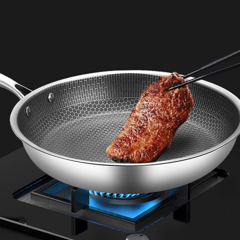 Non-stick stainless steel frying pan, induction ready cookware for easy and healthy home meals.