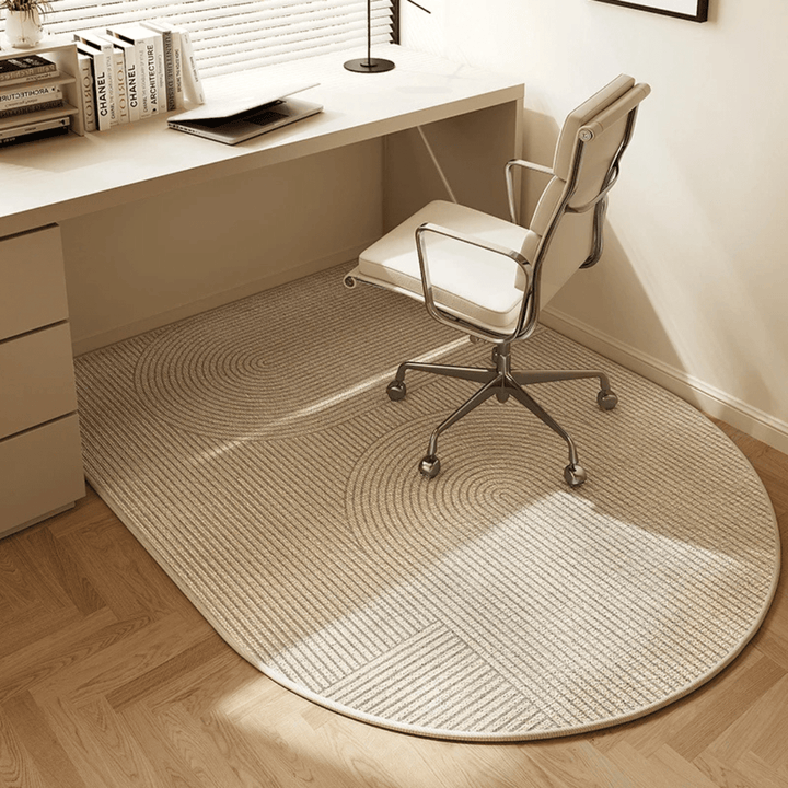 Durable velour office chair mat protecting hardwood floors from scratches & wear in a stylish home office workspace.