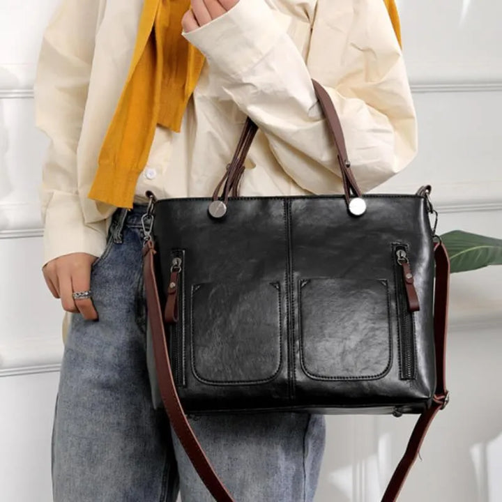 Elegant black women's tote bag, versatile everyday carryall, durable shoulder & crossbody handbag.