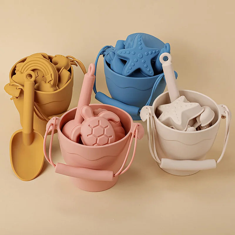 Eco-friendly silicone beach bucket set for kids, includes spade and molds, outdoor sand play.