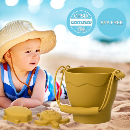 Close-up of a blue eco-friendly silicone beach bucket and star-shaped sand mold for children's play.
