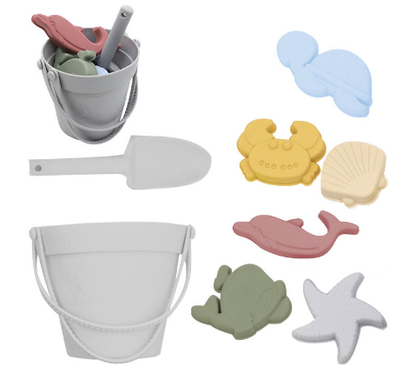 Collection of colorful eco-friendly silicone beach toys: buckets, spades, and fun sand molds for kids.