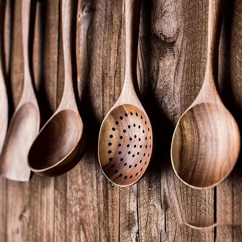 Stylish eco-friendly teak wood utensil set, perfect for sustainable cooking. Ergonomic kitchenware, nonstick safe.