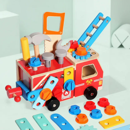 Completed wooden fire truck STEM toy, ready for imaginative play and learning.