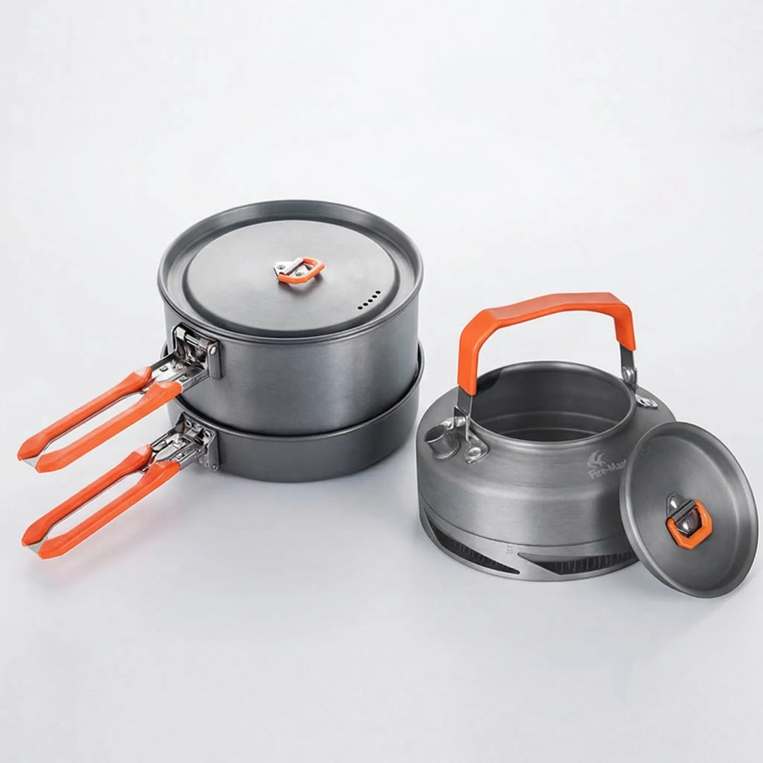 Portable nonstick camping pot and kettle set with heat exchanger, ideal for backpacking outdoor kitchen.