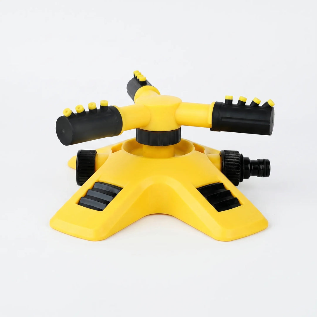Outdoor three-arm rotating garden sprinkler, perfect for yard care & watering systems.