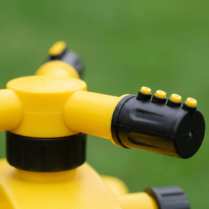 Durable three-arm rotating sprinkler for lawn care, providing wide & uniform water distribution.