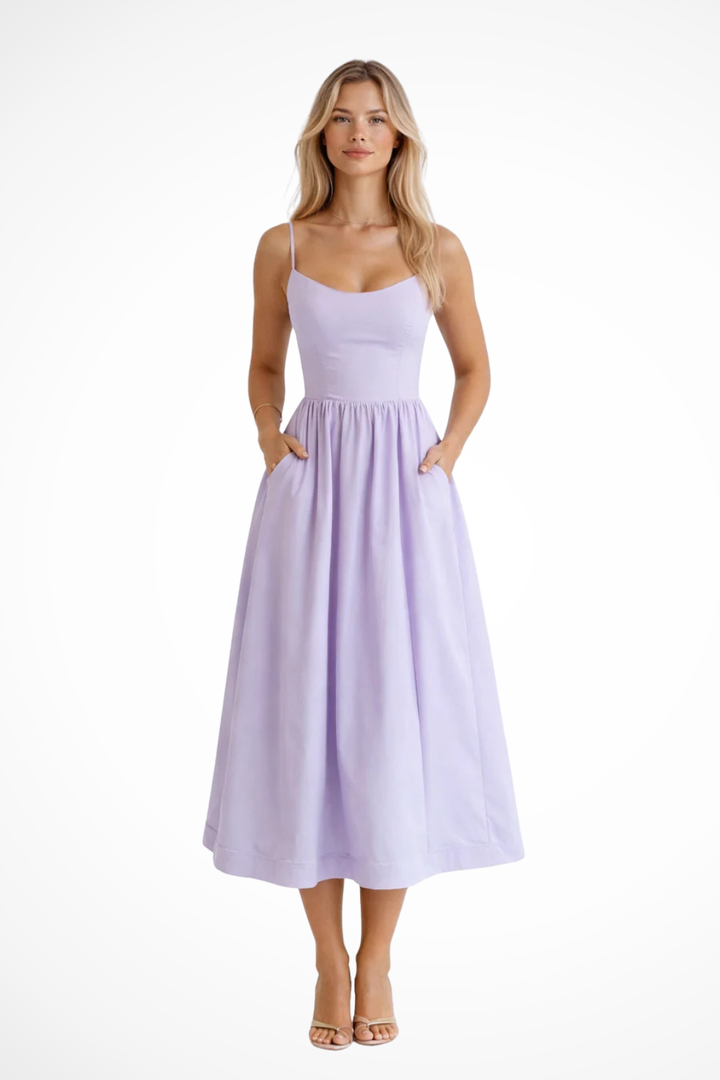 Effortless women's spaghetti strap midi sundress, flowing fabric, perfect for summer vacation.