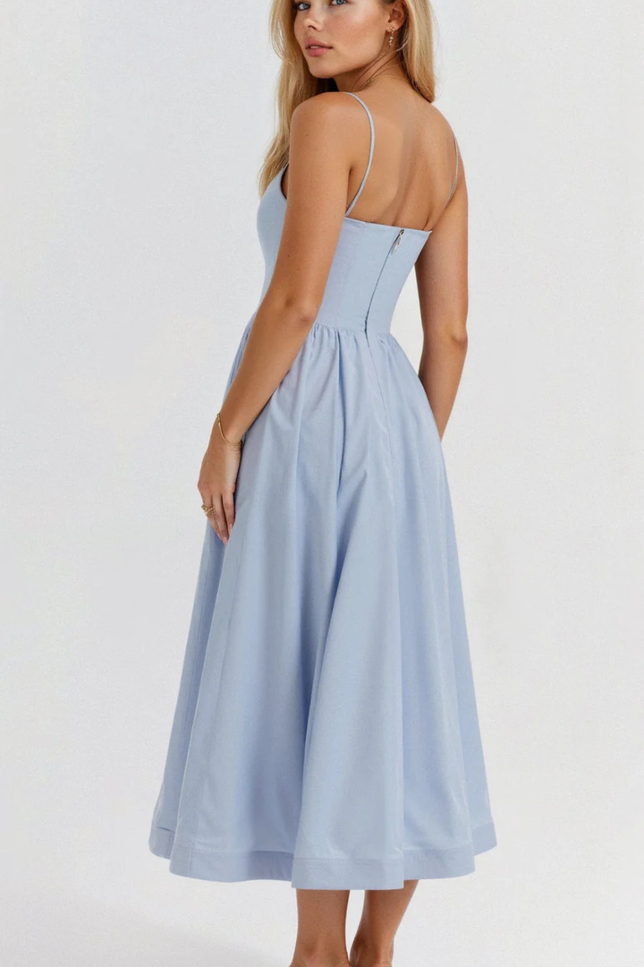 Beautiful women's midi sundress with delicate spaghetti straps, perfect for summer events.