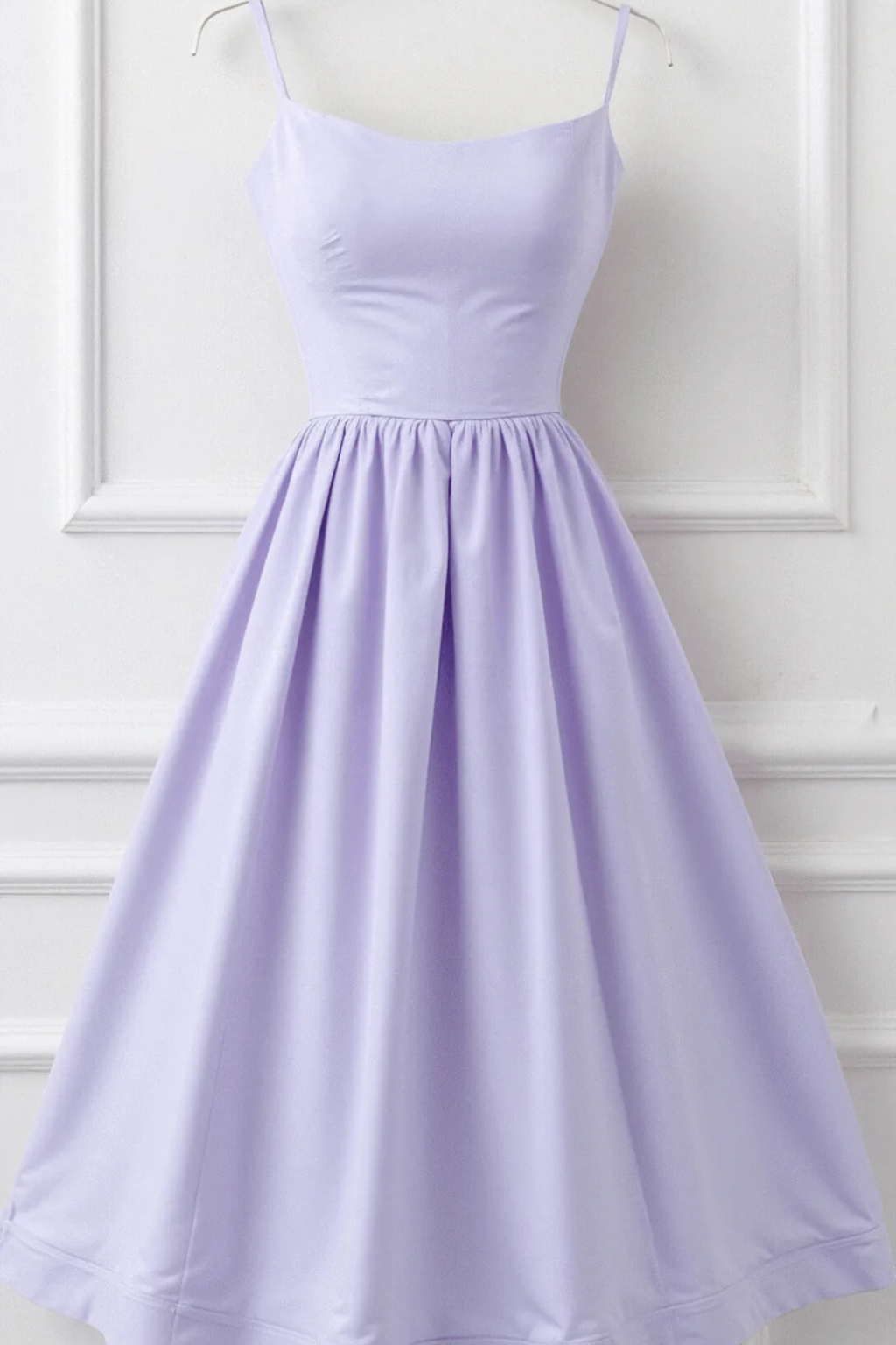 Feminine spaghetti strap sundress, flowing midi dress for women's beachwear & vacation.