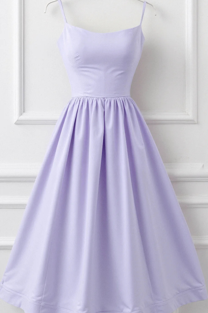 Feminine spaghetti strap sundress, flowing midi dress for women's beachwear & vacation.