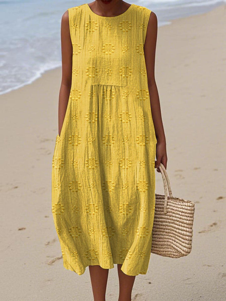 Comfortable women's summer midi dress, sleeveless with pockets, offering a flowy, relaxed fit for everyday.