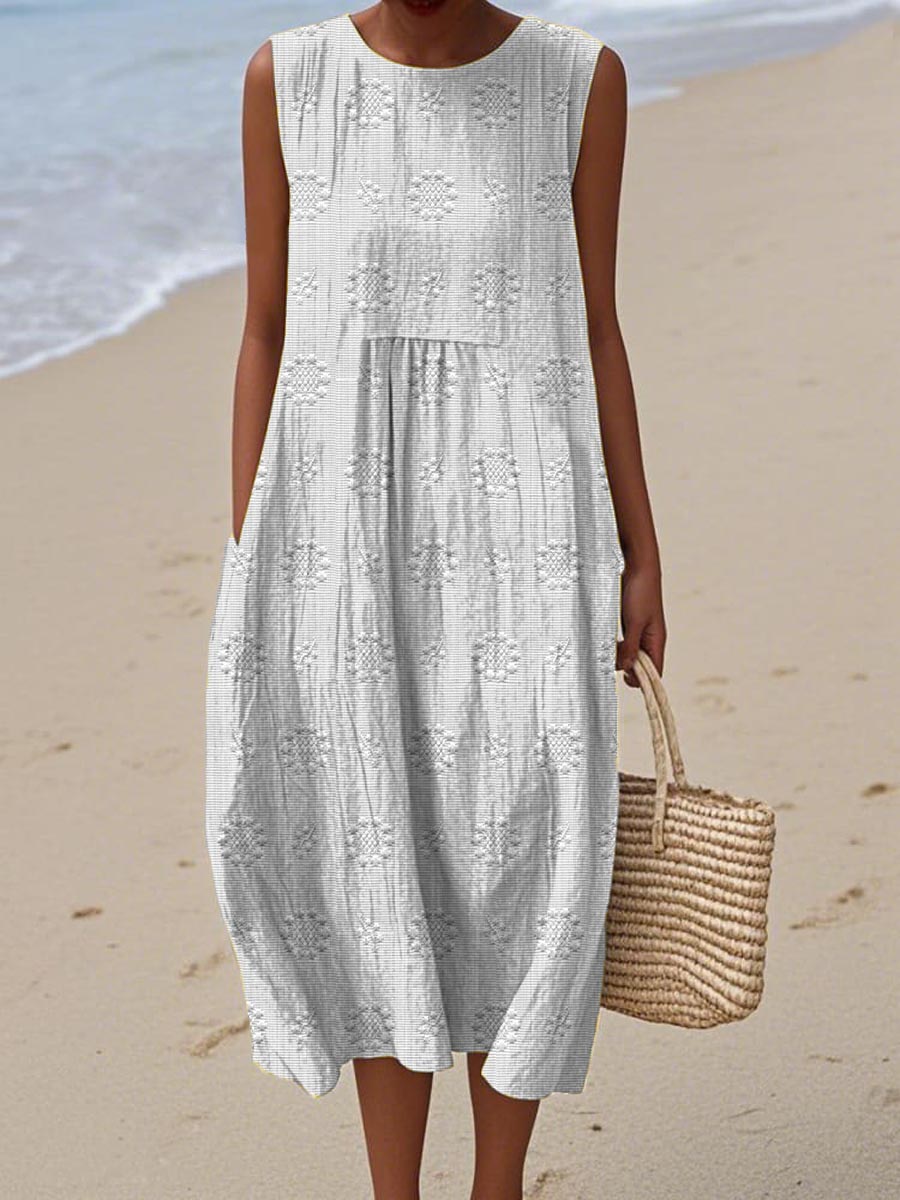 Versatile women's midi dress, ideal for summer. Sleeveless, with pockets, & a relaxed, flowy silhouette.