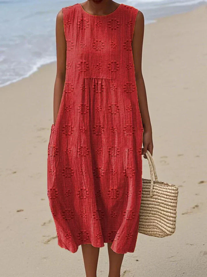 Women's casual summer midi dress with pockets. Sleeveless & flowy for effortless warm weather everyday wear.