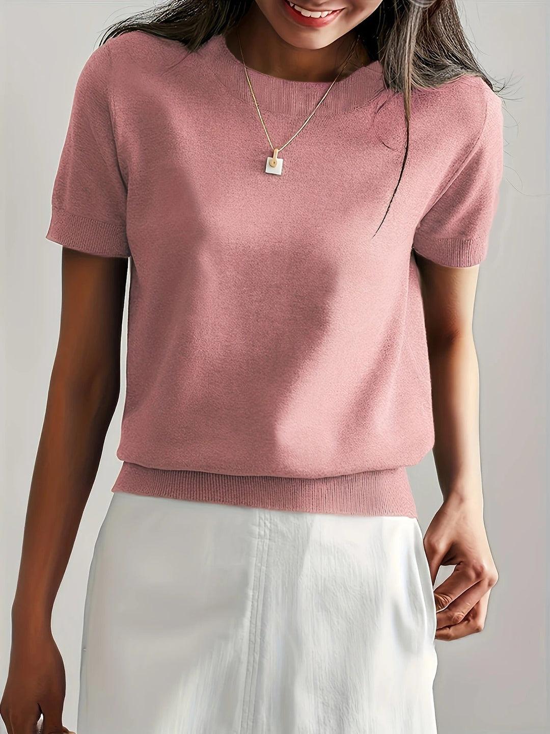 Relaxed women's crew neck short sleeve knit tee, perfect for versatile summer outfits.