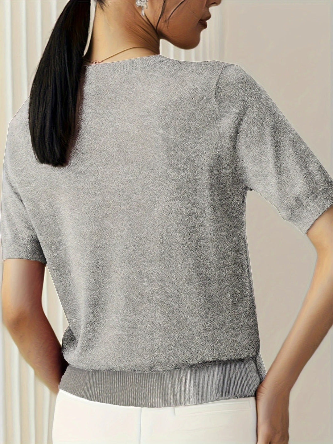 Women's chic short sleeve crew neck top, perfect for casual and versatile styling.