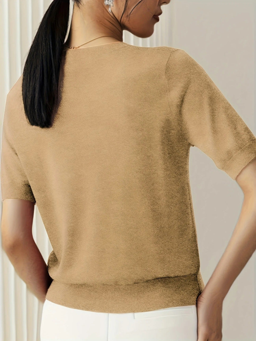 Relaxed fit women's short sleeve knit tee, crew neck, essential for summer comfort.