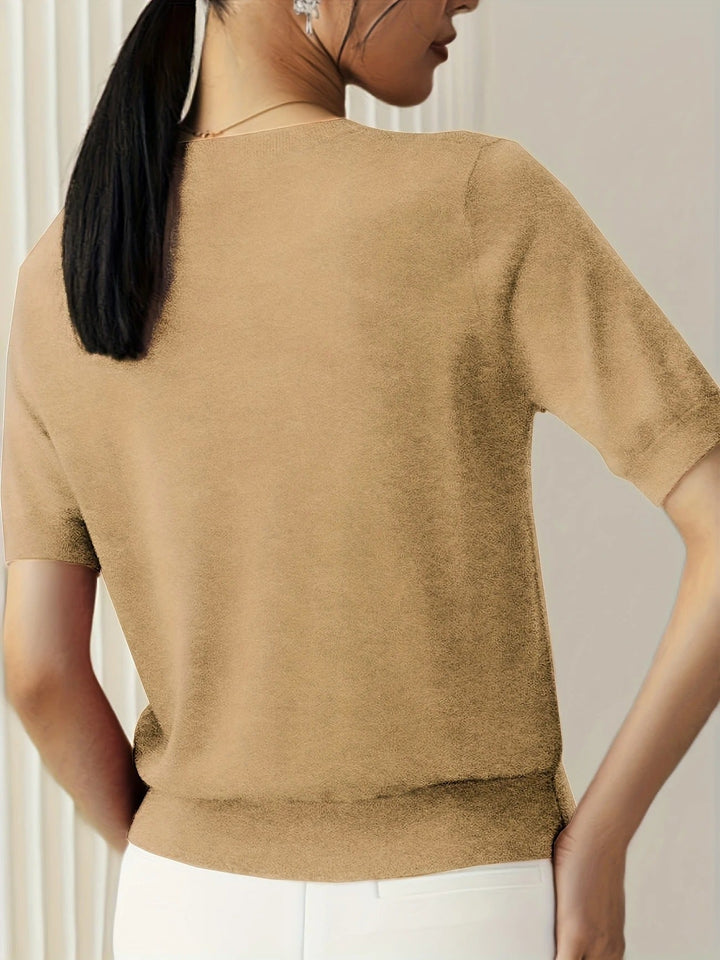 Relaxed fit women's short sleeve knit tee, crew neck, essential for summer comfort.