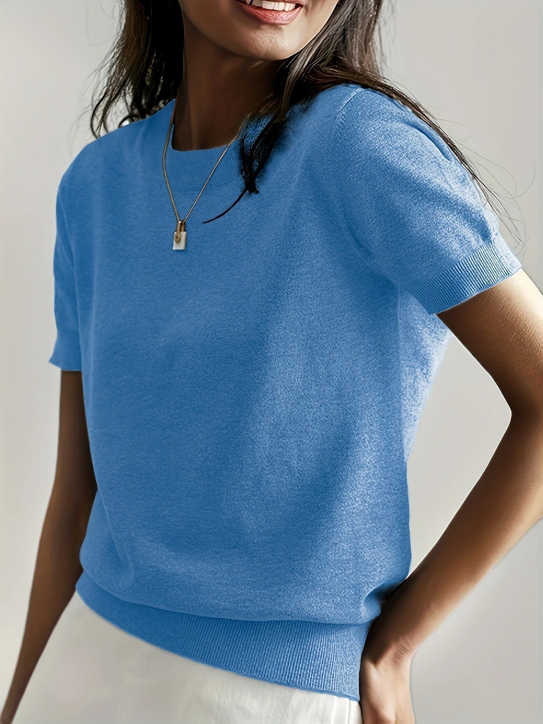 Basic women's short sleeve knit tee, crew neck, versatile for chic casual outfits.