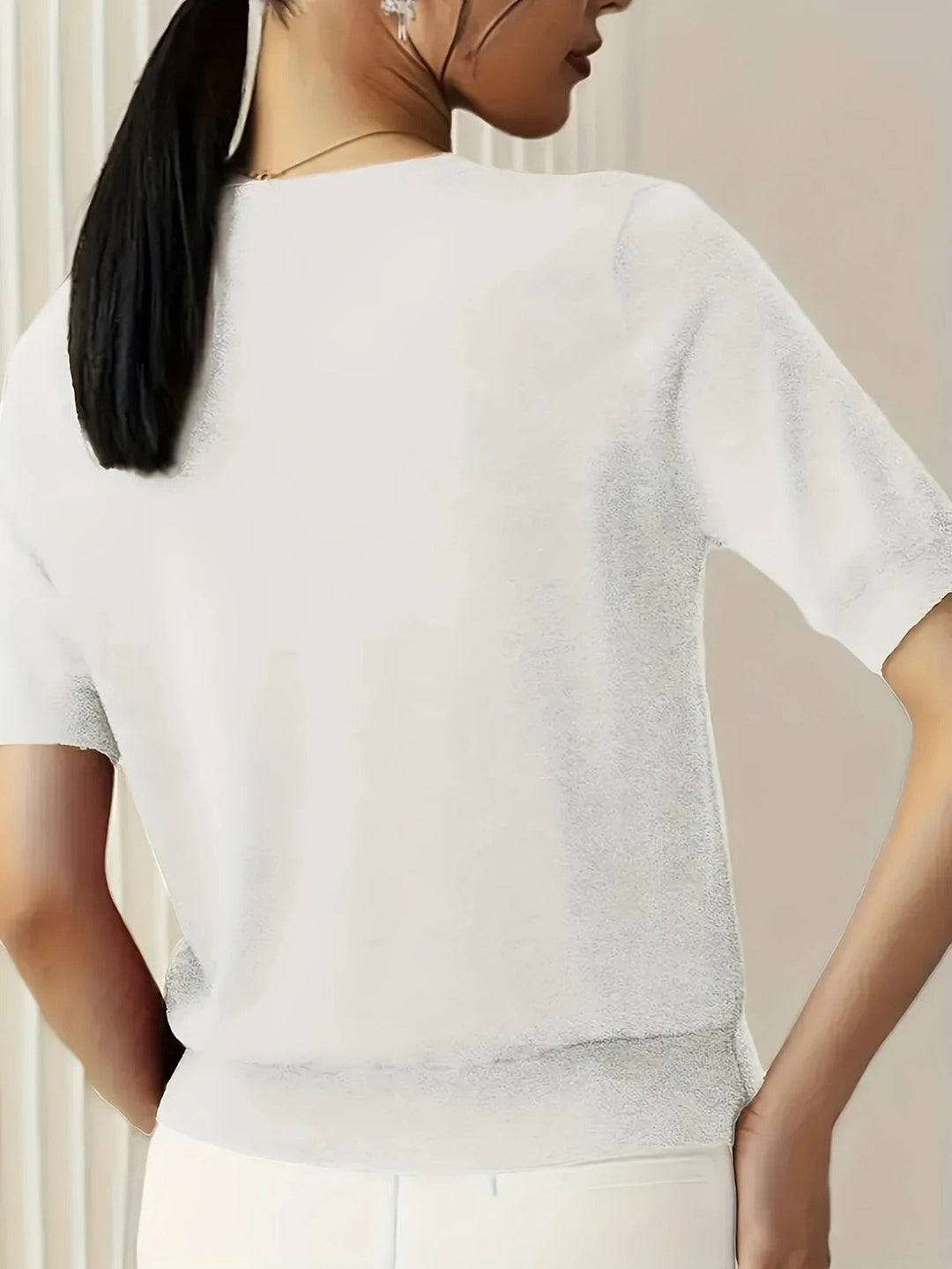 Women's casual knit crew neck top, short sleeve, comfortable for everyday styling.