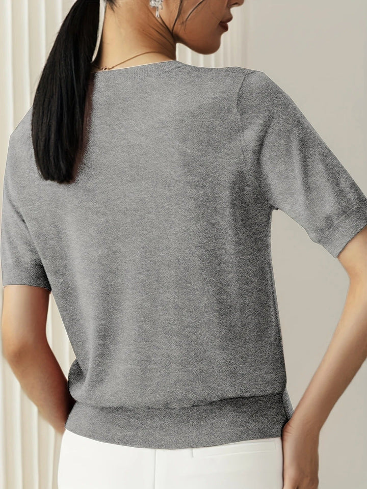 Versatile women's basic crew neck top with short sleeves, ideal for spring outfits.