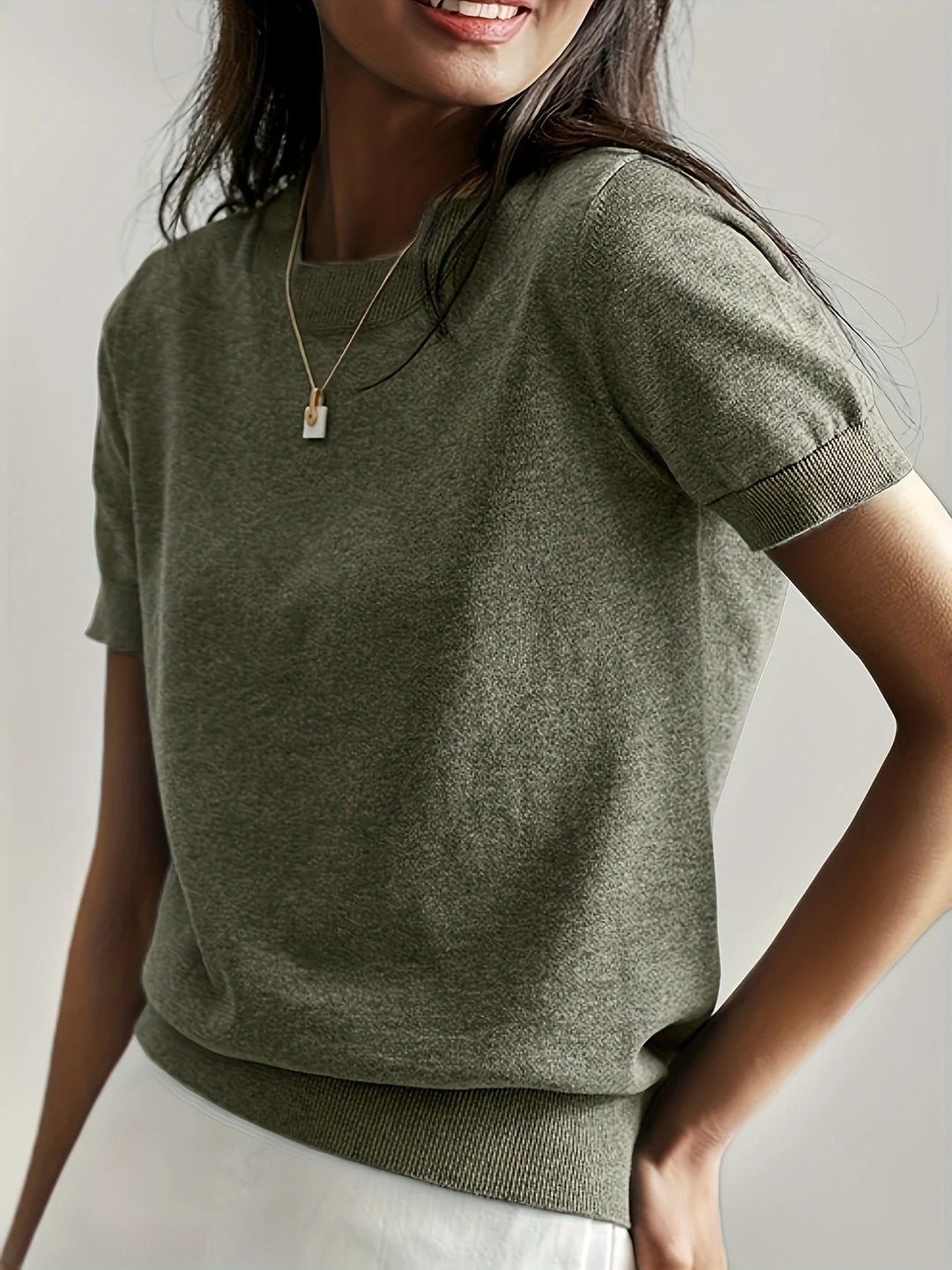 Comfortable knit women's top, short sleeve & crew neck, for chic casual looks.