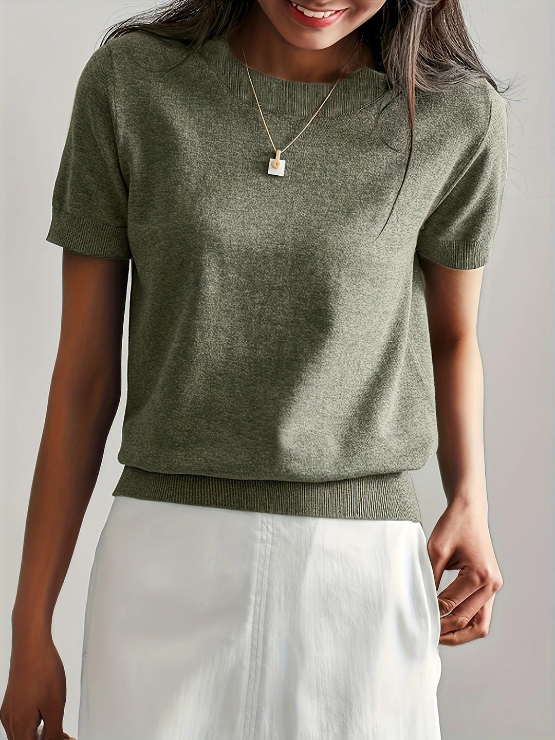 Chic women's short sleeve crew neck tee, a relaxed fit basic for everyday wear.