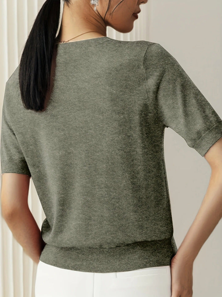 Women's casual crew neck short sleeve top in a soft knit fabric for versatility.