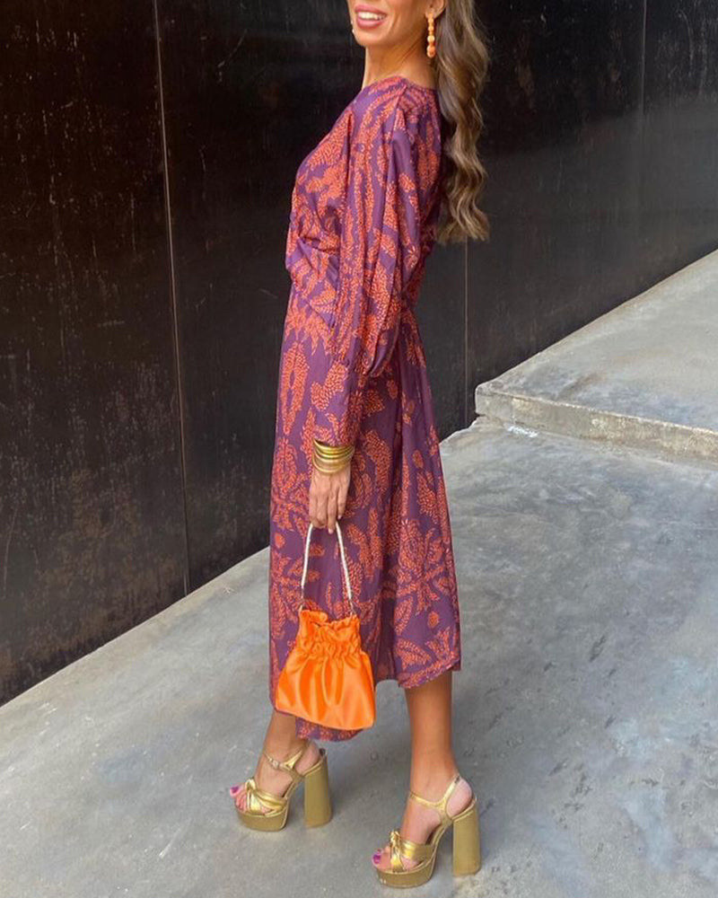 Women's elegant printed A-line maxi dress for wedding guests, formal events & special occasions. Long V-neck design.