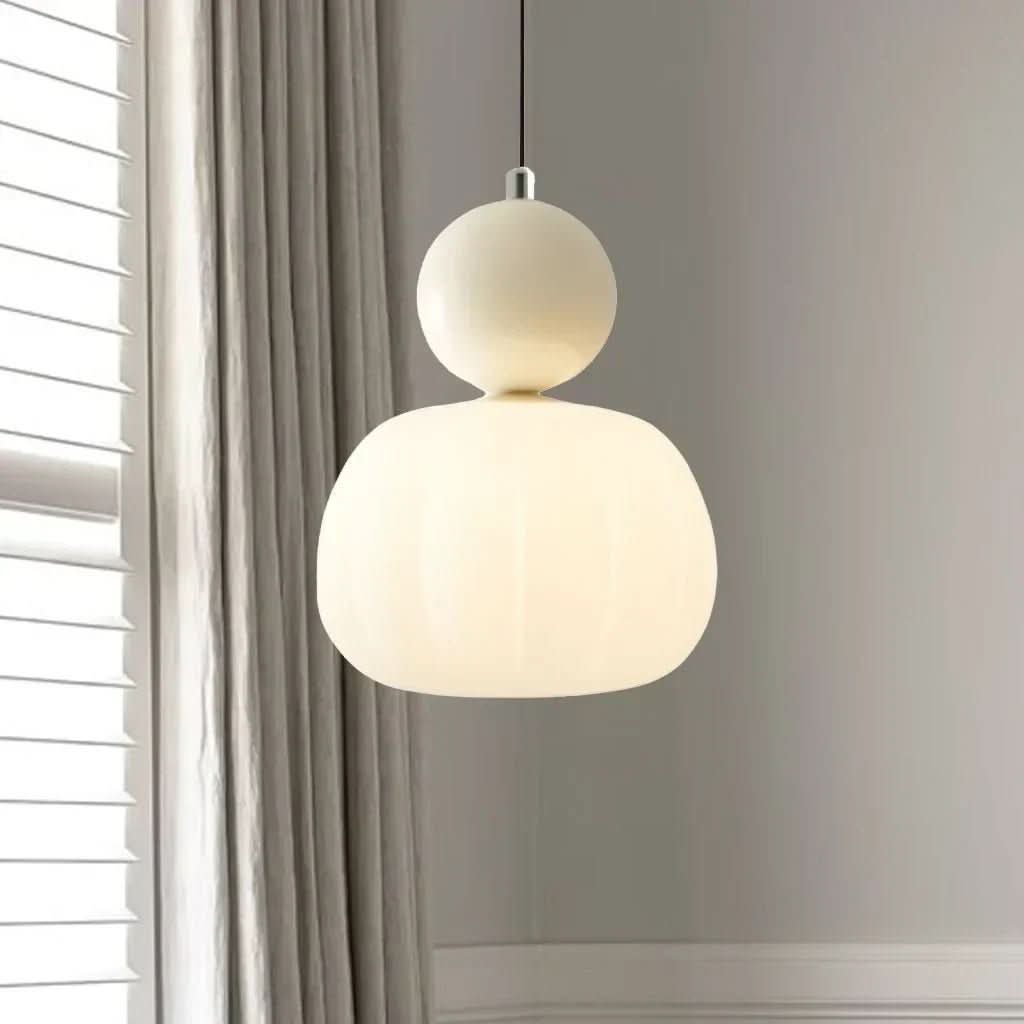 Elegant Art Deco pendant light with geometric metal frame for modern vintage home decor.