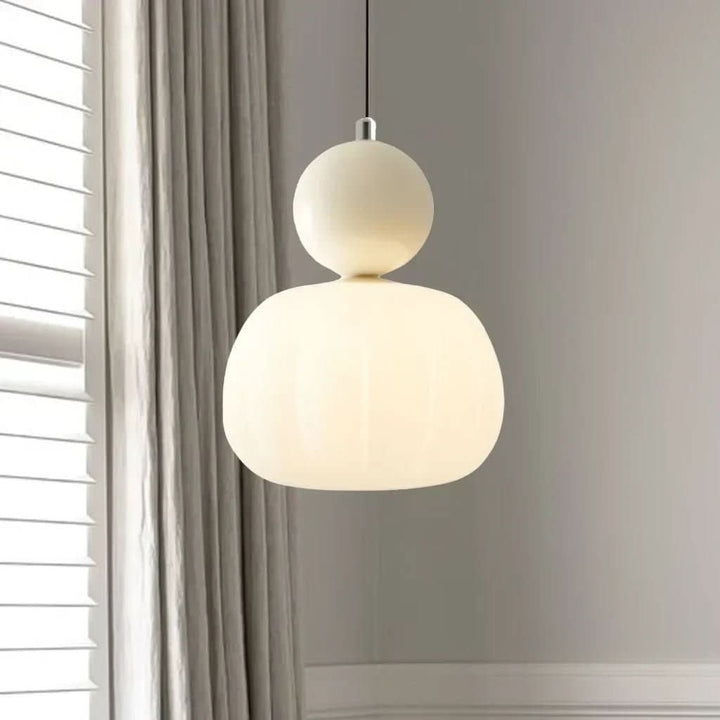 Elegant Art Deco pendant light with geometric metal frame for modern vintage home decor.