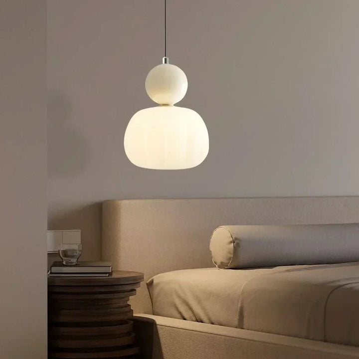Intricate Art Deco pendant lamp with brass accents, ideal for luxurious home lighting.