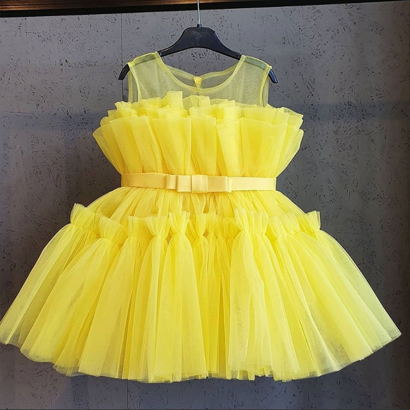 Girls' party dress, elegant white knee-length design with unique puffy mesh sleeves for formal wear.